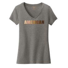 Load image into Gallery viewer, Heather grey women's v-neck cotton/poly short sleeve graphic t-shirt with "American" printed in a gradient of skin tones.