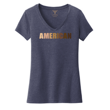 Load image into Gallery viewer, Heathered navy women&#39;s v-neck cotton/poly short sleeve graphic t-shirt with &quot;American&quot; printed in a gradient of skin tones.
